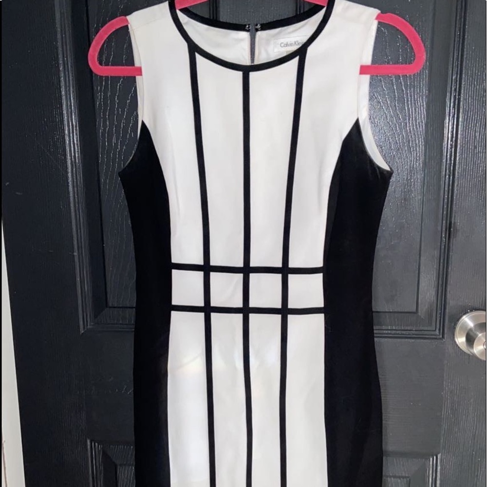 Such a nice tight fitting black and white dress.